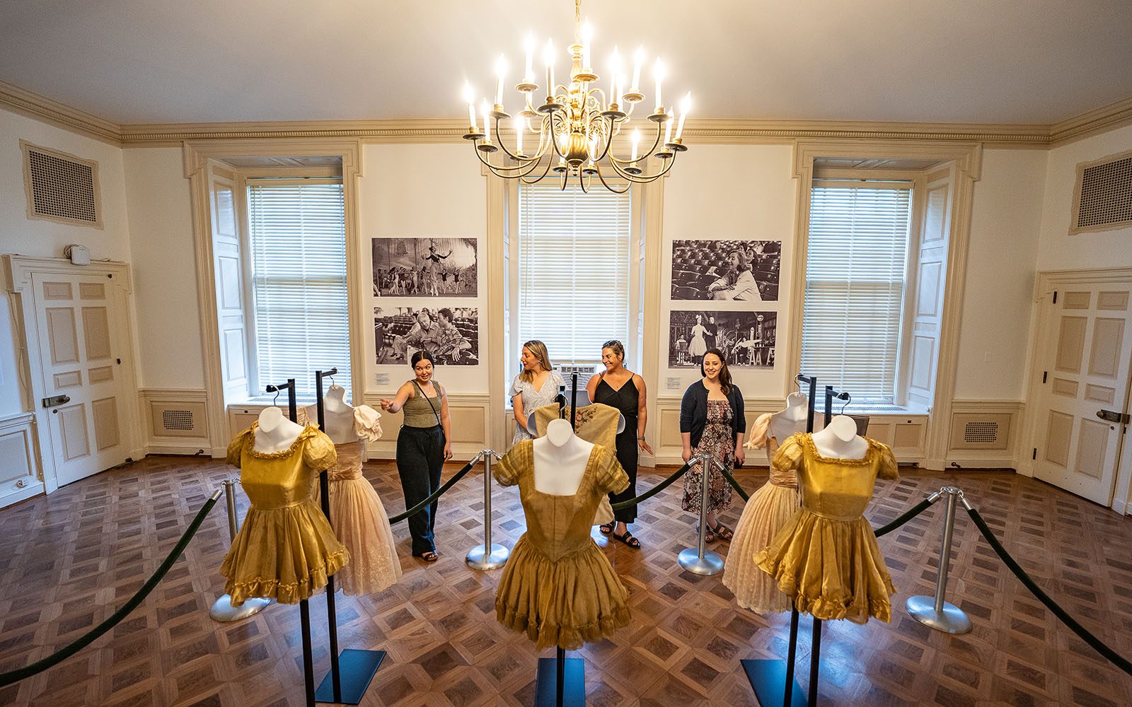 visitors admiring a visual arts exhibit at spac