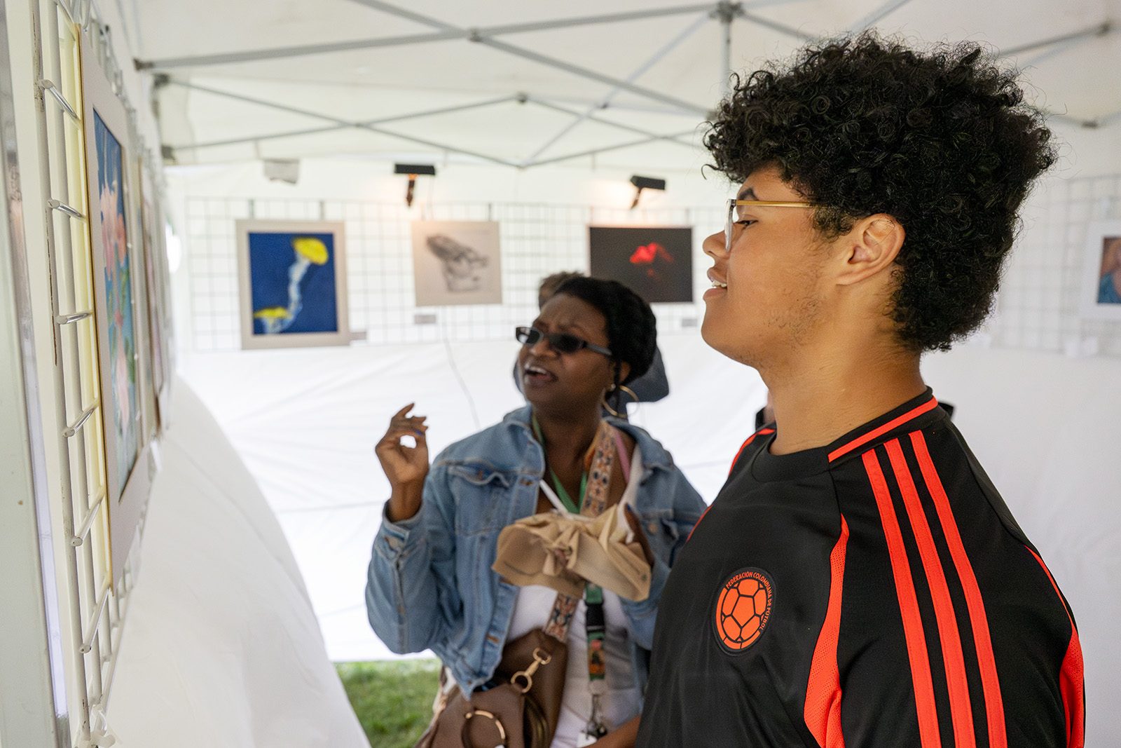 festival of young artists attendees viewing student art